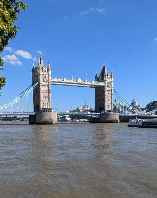 A sightseeing boat on the Thames beside the Tower of London